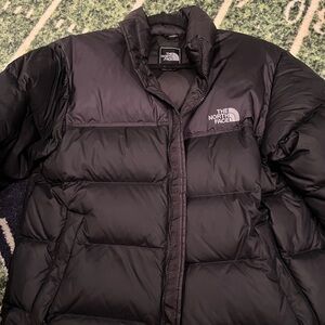 The North Face Black Puffer Jacket like new size medium. Beautiful hardly worn.
